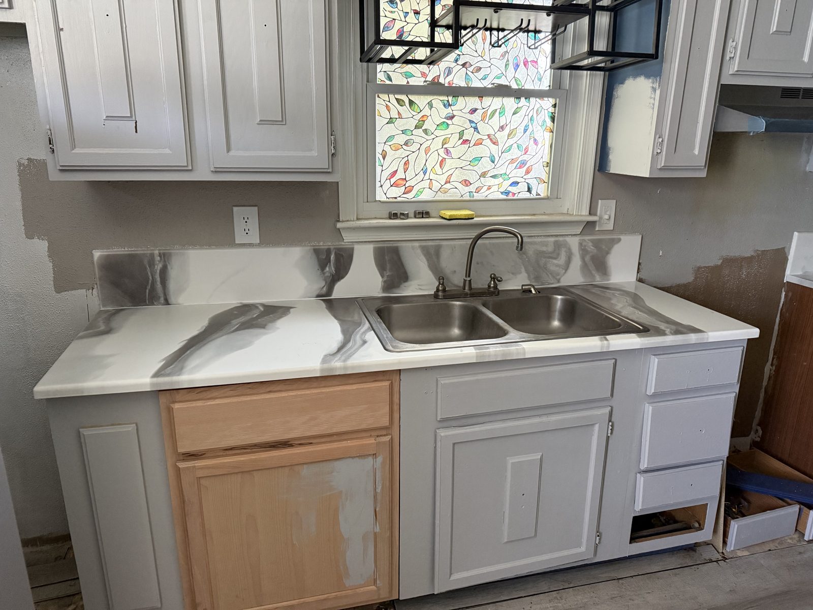 Main sink countertop and backsplash, with room renovation still in progress.