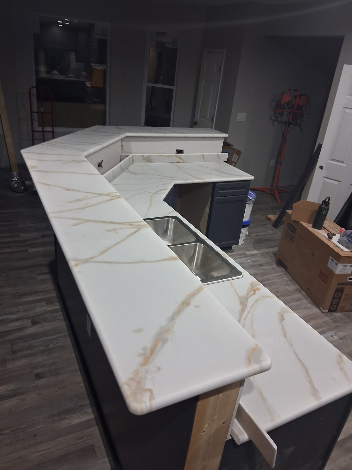 Raised serving ledge and lower kitchen countertops viewed together.